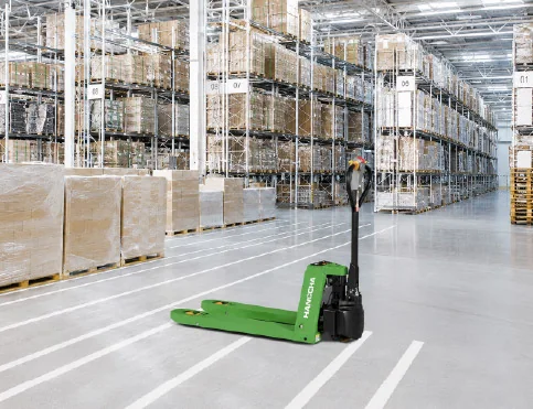 Hangcha WS Series electric pallet truck parked in a large racked warehouse aisle
