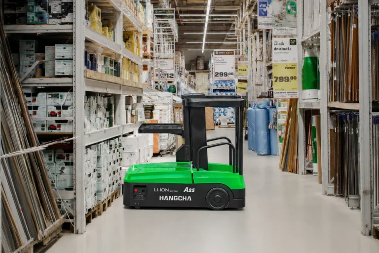 Green Hangcha reach truck in a retail warehouse aisle