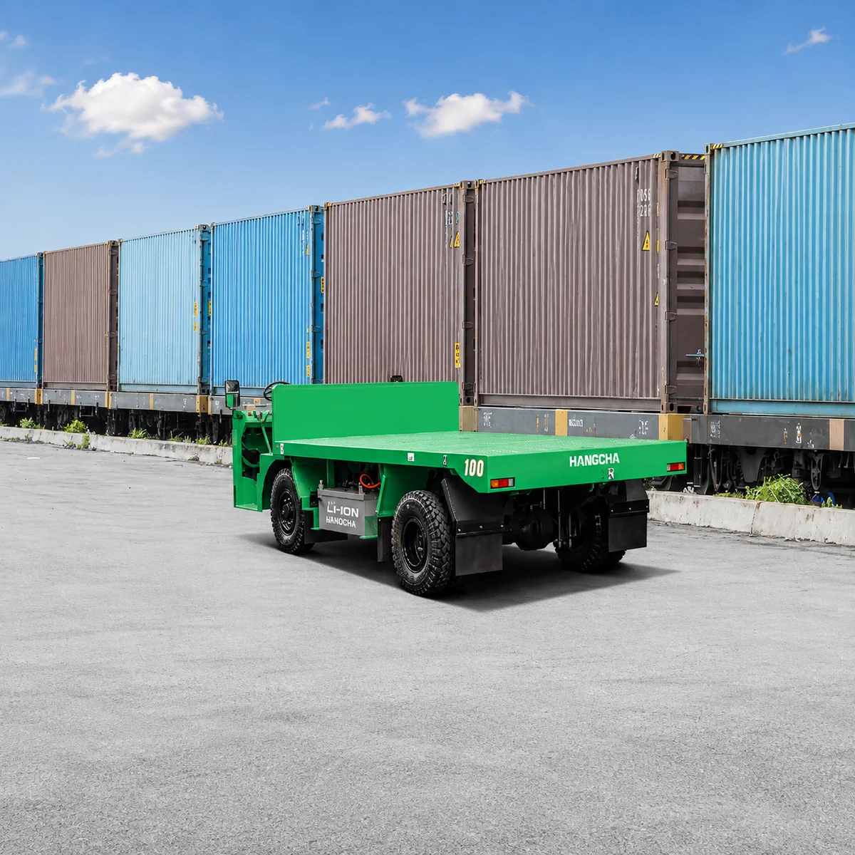 Hangcha electric platform truck driving past stacked shipping containers in a freight yard