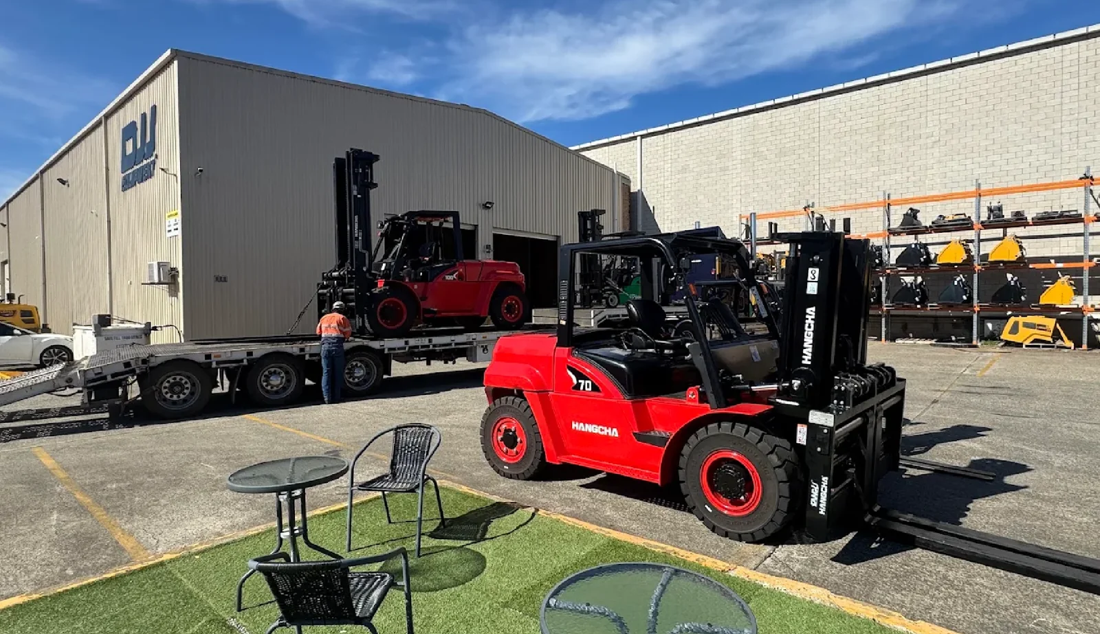 Red Hangcha forklift delivered on a low loader for a long term hire fleet