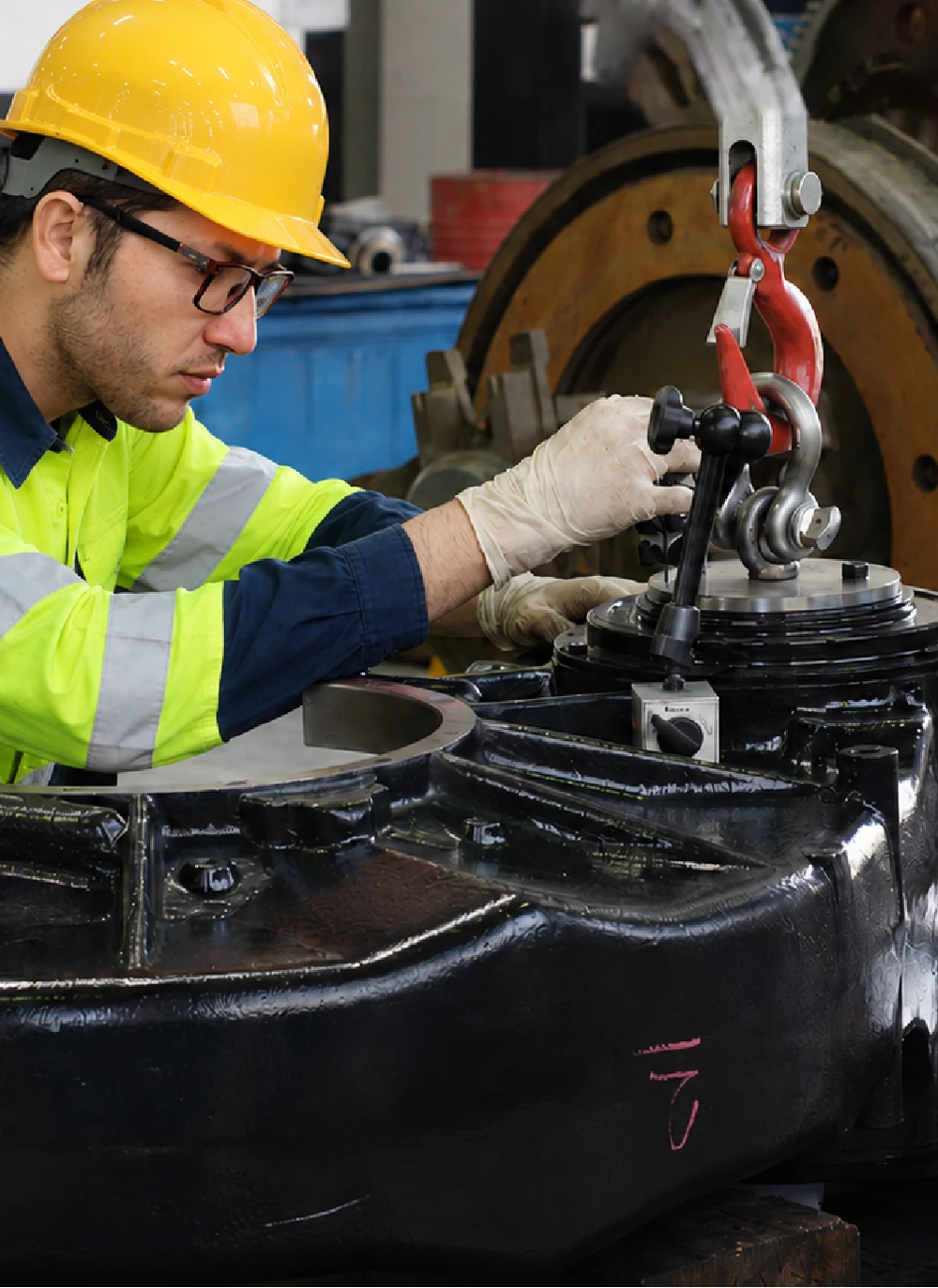 Technician servicing a forklift as part of scheduled maintenance