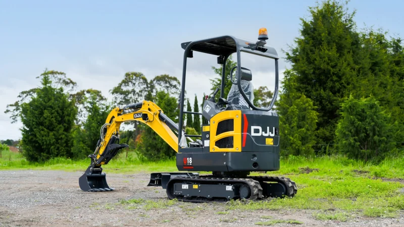 Yuchai U18 mini excavator with the bucket lowered on a gravel yard